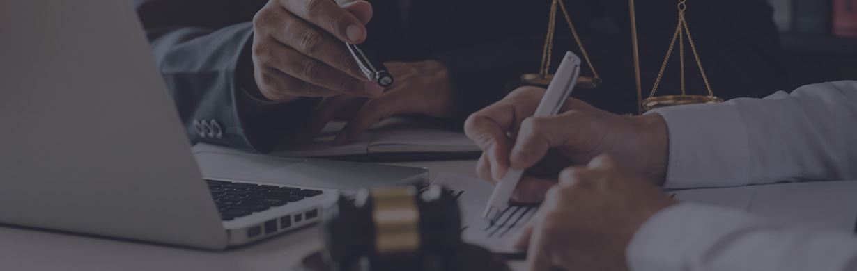 people signing papers