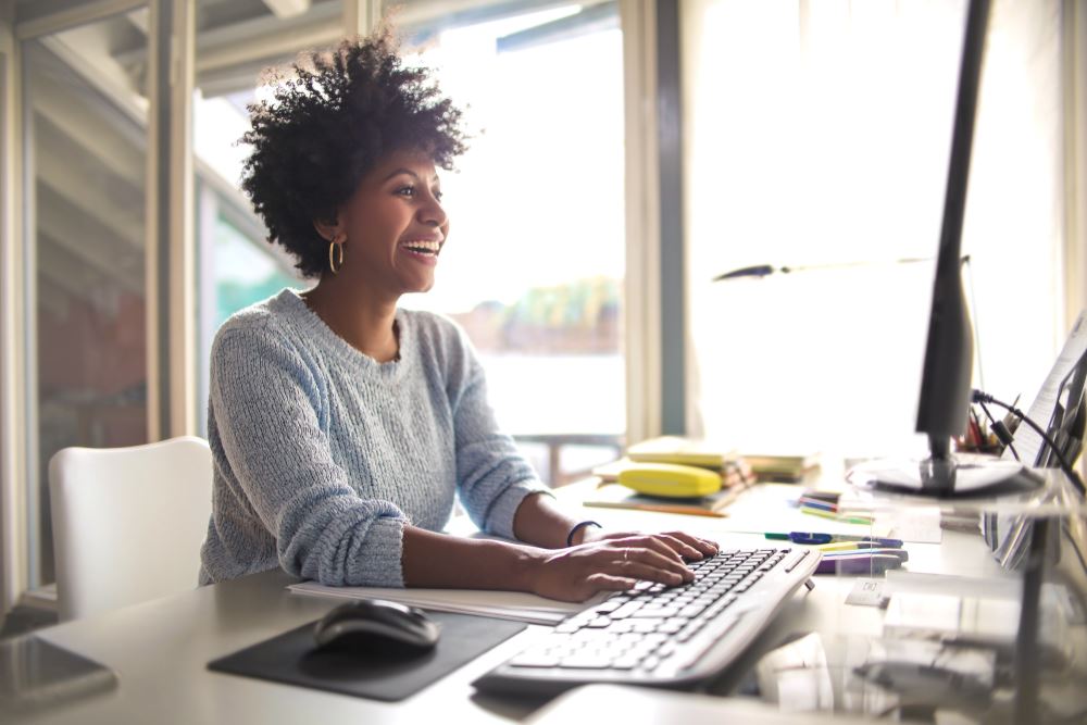 woman typing on laptop